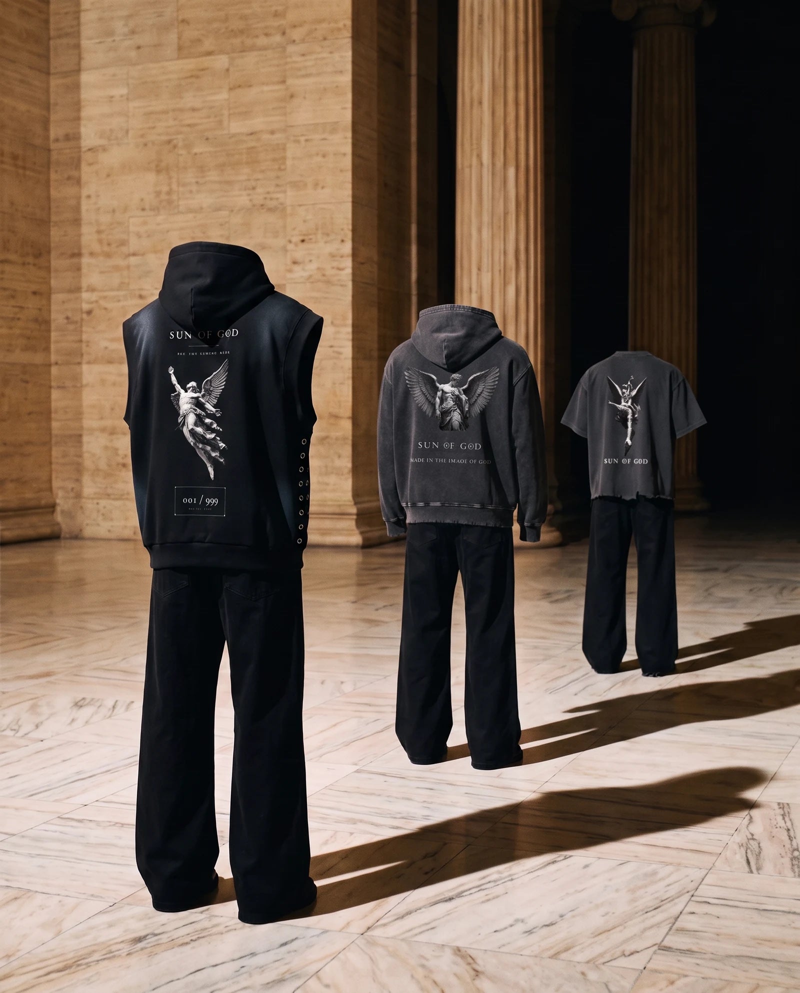 Three empty garments standing in a marble hall